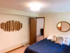 Basement king bedroom with en suite bathroom at Cave and Creek cabin