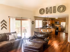 Open concept living room with vaulted ceiling at Cave and Creek